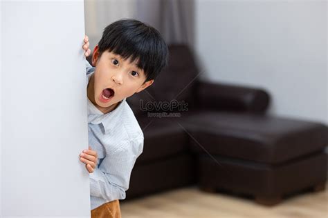 Little Boy Hiding Behind The Wall Picture And Hd Photos Free Download