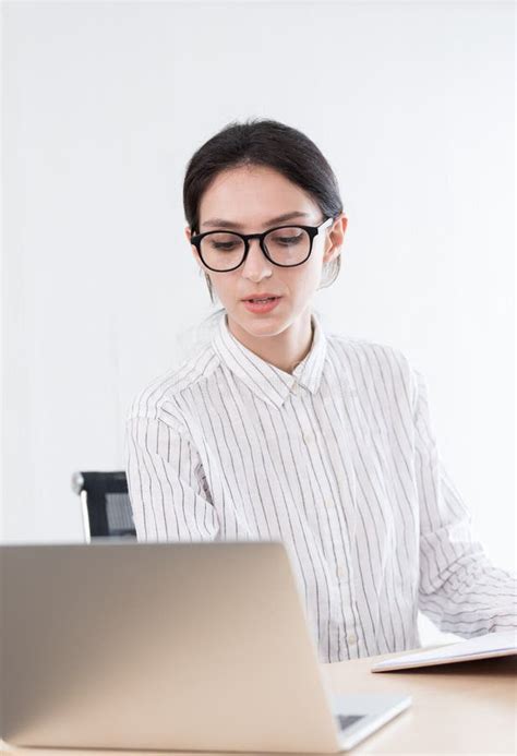 A Businesswoman Wearing Glasses Working With Smiling And Happiness At The Office Stock Image