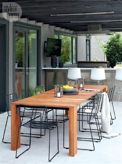 contemporary covered patio  filled   teak dining