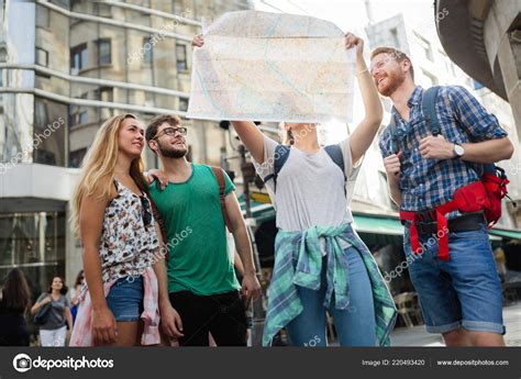 Happy Group Tourists Traveling Sightseeing Together Stock Photo By