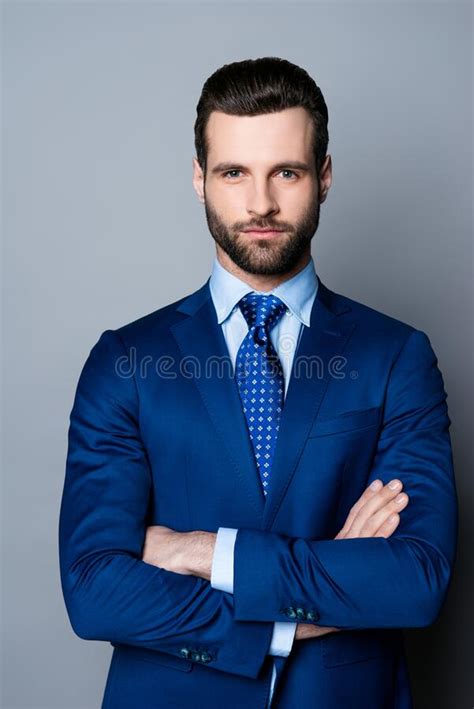 Portrait Of Serious Fashionable Handsome Man Posing In Blue Suit And