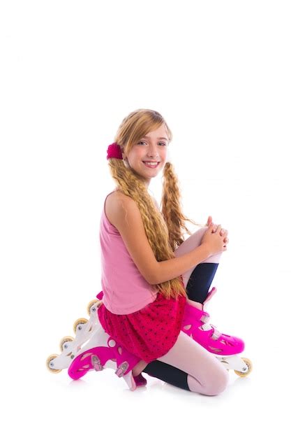 Premium Photo Blond Pigtails Roller Skate Girl On Her Knees Happy