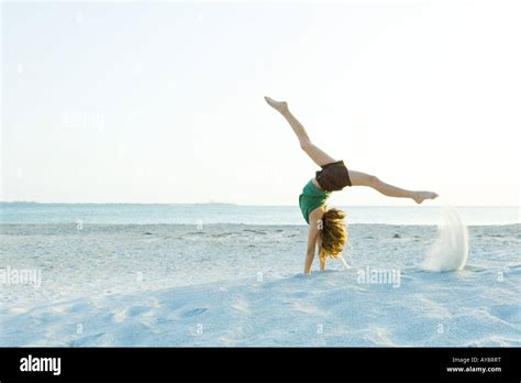 Little Girl Doing Handstand At The Beach Side View Stock Photo Alamy
