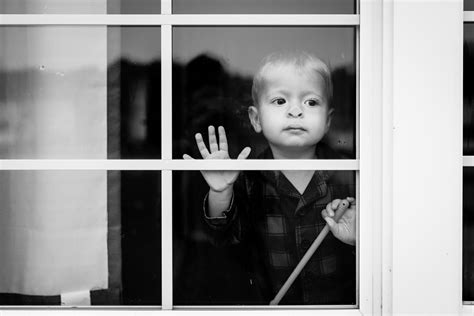 Baby With Nose Pressed Against The Window On A Rainy Day By Tara Fletcher