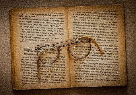 Royalty Free Photo Eyeglasses With Silver Frames On Beige Book Pages