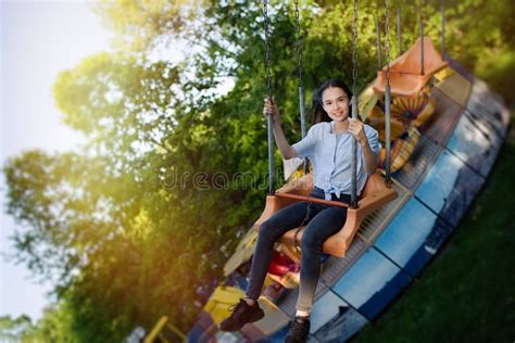 teenage girl riding chain carousel swing at amusement park stock image image of circle