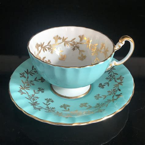Aynsley Tea Cup And Saucer Fine Bone China England True Aqua Heavy Gold Flowers And Leaves