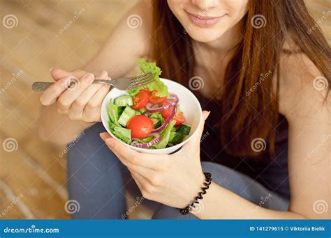Close Up Young Caucasian Woman Eating Fresh Vegetable Salad Stock