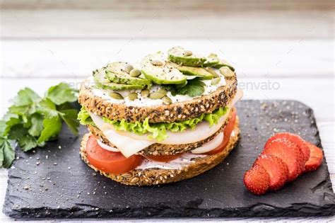Three Layer Sandwich With Variety Of Vegetables Turkey Meat And