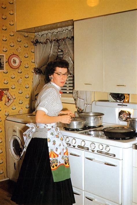 Vintage Yellow Kitchen Vintage Lady Cooking Wearing An Apron Cat