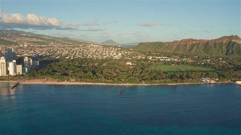 A Drone View At Sunset Of Waikiki Beach And Diamond Head Crater A