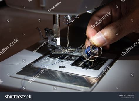 Hand Replacing Thread Spool Sewing Machine Stock Photo 1142236820