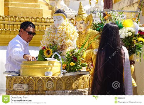 Buddhist Devotees Bathing Buddha Statues At Shwedagon Pagoda Editorial