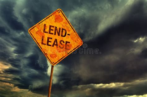 Dramatic Cloudy Sky And Old Yellow Rhombic Road Sign Stock Image
