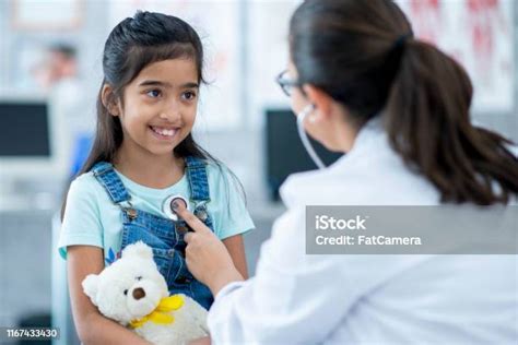 Cute Little Girl At Doctors Office Stock Photo Download Image Now