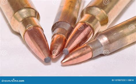 Four Rifle Bullets Two 223 Caliber And Two 300 Winchester Magnum