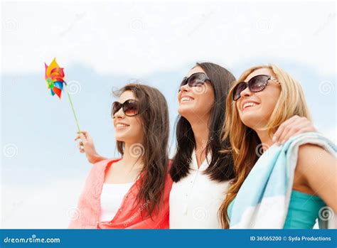 Smiling Girls In Shades Having Fun On The Beach Stock Photo Image Of Hanging Pretty