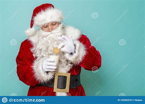 Santa Eating Cookies And Drinking Milk Stock Photo Image Of Happiness