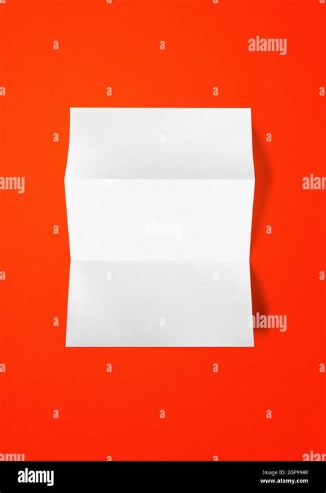 Blank Folded White A4 Paper Sheet Mockup Template Isolated On Red