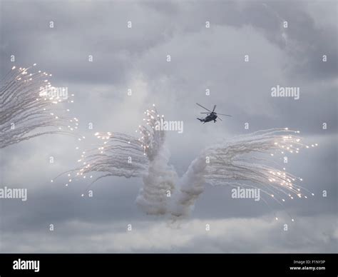 Helicopter Releasing Anti Missile Flares Stock Photo Alamy