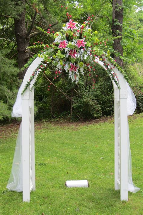 Arbors are ideal for framing a pretty view or dressing up a path, and they look especially charming when placed across a front walkway. A beautiful Wedding Arch or Arbor | Wedding trellis, Birch ...