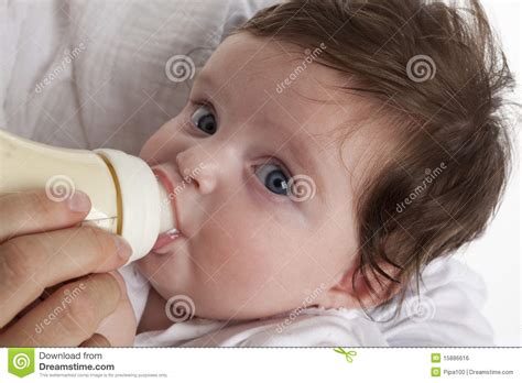 Baby Girl Drinking From A Baby Bottle Stock Photo Image