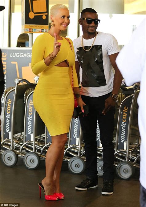 Amber Rose Flashes Some Underboob In Super Tight Yellow Dress Daily