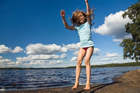 Nine Year Old Girl Jumping In The Air At License Image 70340923