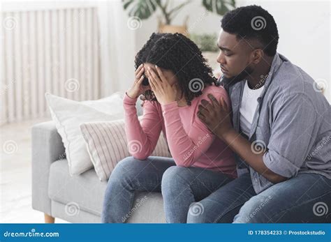 Caring Black Boyfriend Comforting His Upset Crying Girlfriend At Home