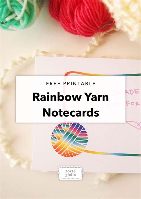 The Rainbow Yarn Notecard Is Next To Two Balls Of Yarn