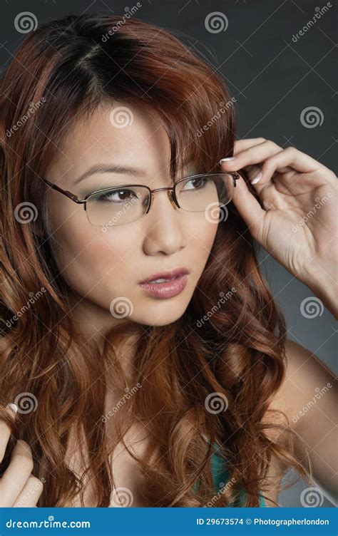 Beautiful Chinese Woman Wearing Glasses Over Colored Background Stock