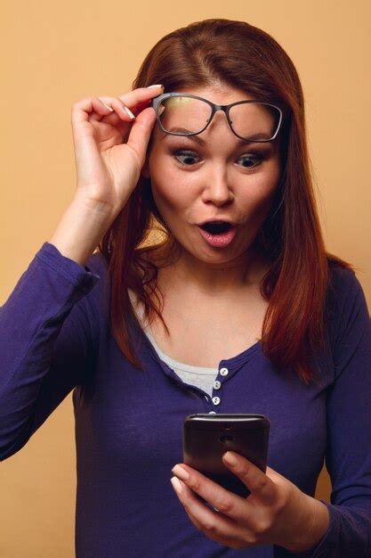 Premium Photo Woman Takes Off Her Glasses With Astonishment