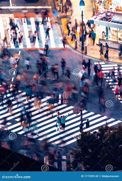 Pedestrians Cross The Shibuya Scramble Crosswalk In Tokyo Japan