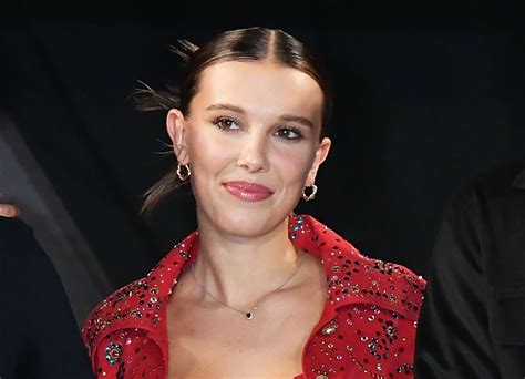 Millie Bobby Brown Poses With Her Summer Read In A White Bikini Parade