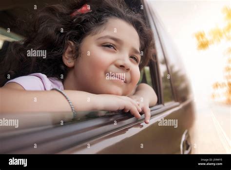 Girl Looking Out Car Window Stock Photo Alamy