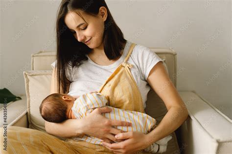 Newborn Baby Babe Sucking Milk From Mothers Breast Portrait Of Mom And Breastfeeding Baby Stock