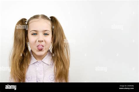 Portrait Of Girl Sticking Out Tongue Hi Res Stock Photography And