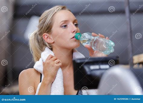 Beautiful Young Woman Drinking Water In Gym Stock Photo Image Of