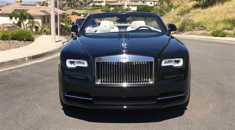 Borrowing looks but not body panels from the wraith & ghost models. Rolls-Royce Dawn Black 2-door Convertible - Exotic Cars ...