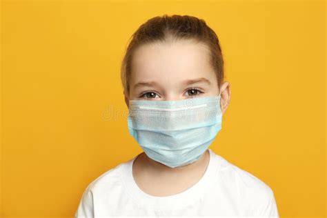 Cute Little Girl In Protective Mask On Yellow Stock Image Image Of