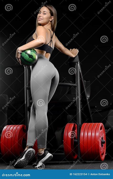 Pretty Caucasian Fitness Woman Pumping Up Muscles Workout Fitness And Bodybuilding Concept Gym