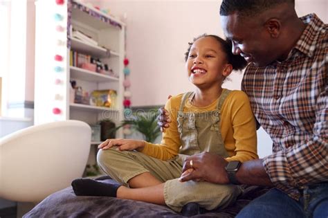 Father And Daughter At Home In Girl S Bedroom Chatting And Laughing Stock Image Image Of