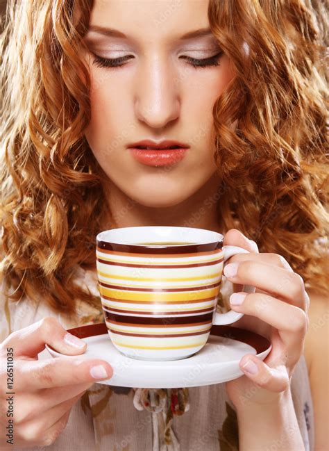 Foto Stock Beautiful Girl Drinking Tea Or Coffee Adobe Stock