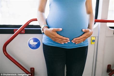 Eight Months Pregnant Brydie Lee Kennedy Sits On A Mans Hand On Bus