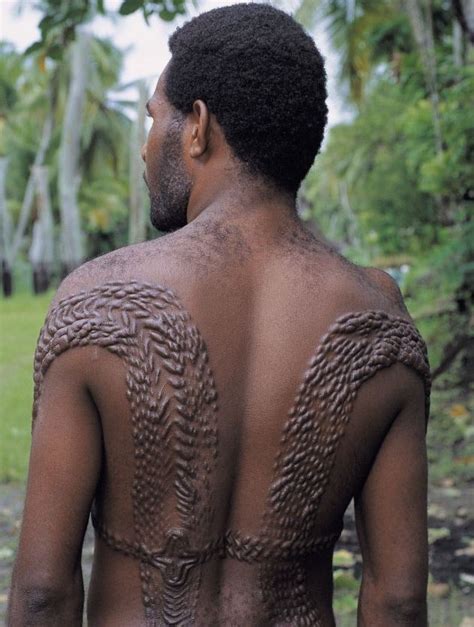 A Tribe In New Guinea Give Men Crocodile Scars To Honour Their