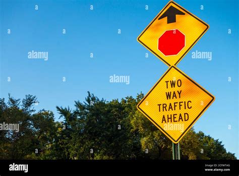 Two Way Traffic Ahead Sign With Ted Stop Sign Icon And Arrow Trees And