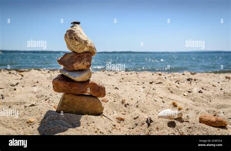 Easy Pebble Stack On A Sandy Beach Stock Photo Alamy
