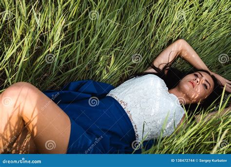 Beautiful Girl Lying Down At Grass Royalty Free Stock Image 138472744
