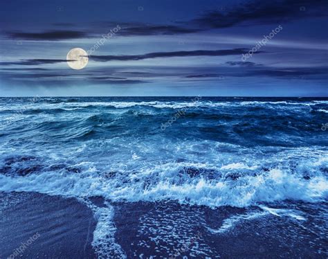 Sea Waves Crashing On Sandy Beach At Night — Stock Photo © Pellinni