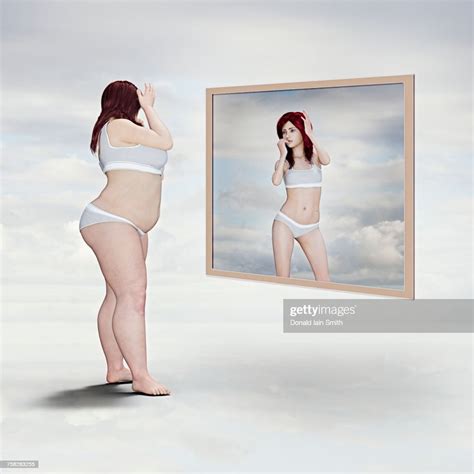Overweight Woman And Reflection Of Skinny Woman In The Mirror High Res
